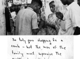 A woman in India buying a comb from a street vendor during WWII.  Photo from Mary Bernald.