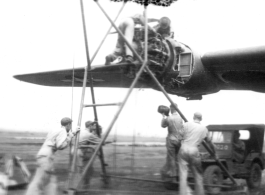 "This Is A Group Of 396th Mechanics Changing A B-24 Engine At Luichow (Liuzhou), China."