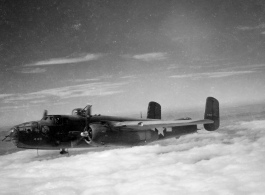 B-25 Mitchell bombers in flight in the CBI, in the area of southern China, Indochina, or Burma.