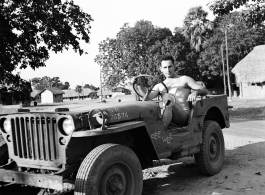 David Firman, 61st Air Service Group, at the wheels of a jeep nicknamed "Pee Wee"  in the CBI during WWII.  From the collection of David Firman, 61st Air Service Group.