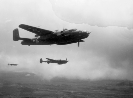 B-25 Mitchell bomber, tail number #448, and P-38s in flight in the CBI, in the area of southern China, Indochina, or Burma.