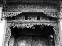 An ornate wooden surround for a doorway in China, for a building/courtyard taken over by Nationalist military or government. During WWII.  From the collection of Frank Bates.