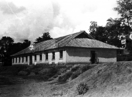 A building in the CBI, presumably used by the 27th Troop Carrier Squadron. During WWII.