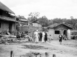 An American photographer visits a village near Yangkai, Yunnan province, China, during WWII.