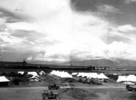 American tent camp on Burma Road in the Xiaguan/Dali area, with Erhai Lake in the background. During WWII.