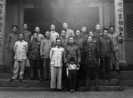 A group of local soldiers--likely a local militia or local KMT-affiliated warlord soldiers--in Yunnan, China, during WWII. They are standing before a temple.