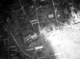 Bombing of small town with extensive bomb trenches in a region of savanna, either in Burma or French Indochina. During WWII.