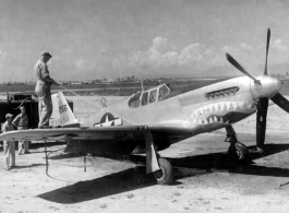 At this point, with full unit markings not yet applied, GIs in China use a decontamination unit to wash down the North American P-51 #42-106971 nicknamed "Big Blue Eyes." August 7, 1944.  The "Mustang" fighter and pilot were lost on January 14, 1945 while assigned to the 8th Fighter Squadron (Provisional), 3rd Fighter Group (Provisional), CACW, with 1LT Van N. Moad, Jr. at the controls.