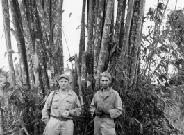 Engineers of the 797th Engineer Forestry Company pose before bamboo in Burma.  During WWII.