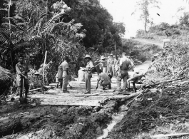 797th Engineer Forestry Company in Burma: A corduroy road section (log road  timber trackway) on the Burma Road.  During WWII.