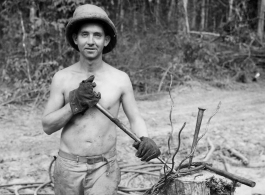 Engineer of the 797th Engineer Forestry Company in Burma, weaving a pulling eye in cable.  During WWII.