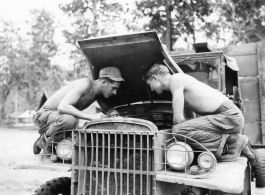 Engineers of the 797th Engineer Forestry Company at work on a truck in Burma.  During WWII.
