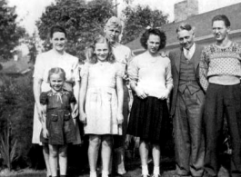 Clarence I. Anderson, Pvc., Service No. 19059691, in the back row in uniform in 1943, in Seattle, WA, with his younger brother and three younger sisters, as well as his mother Ester (far left) and father Ivan (second from the right). 