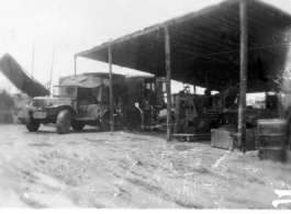Men of the 2005th Ordnance Maintenance Company, 28th Air Depot Group, working on ordnance in a shed in Burma. During WWII.