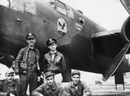 Flyers with B-25 Mitchell bomber.  Rear: Wendell Hanson, J. Percival.  Front: Unknown, Frank McKenna (center), and Sgt. Douglas Bell (right).  22nd Bombardment Squadron, in the CBI.