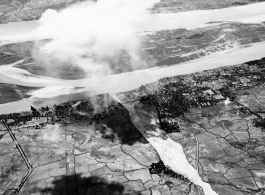 American bombing bridge at Bakkoku, Burma via B-25s of the 22nd Bombardment Squadron during WWII.
