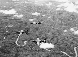 B-25s of the 22nd Bombardment Squadron in flight over thick forests in SW China or Burma during WWII.