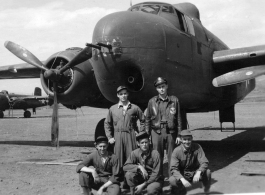 Flyers with 22nd Bombardment Squadron B-25 Mitchell bomber at an American base in China during WWII.  Rear: Bob Selmer, David Hayward.  Front: George Scearce (right).