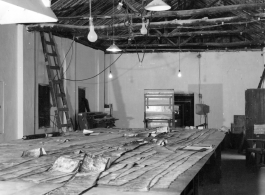 "Print Stripping" at photo lab of the 24th Mapping Squadron--laying out related photographic prints as they were photographed on the negatives. February 12, 1945.