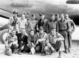 Alice Chong on the Kunming air strip posing before a C-54 with some of her 14th U.S.A.A.F buddies in 1944. Note the blood chit prominently-displayed inside the flying jacket of the Colonel Pilot at center rear. Captain Addison Bailey (in dark shirt) to Alice’s immediate right-all others unidentified.
