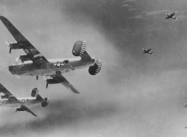 B-24s bombing Sinshih, 8.6.1944.  Consolidated B-24J-25-CO Liberator "Burma Queen" (308th BG 425th BS; #42-73253).  Consolidated B-24J-35-CO Liberator "Krachy Kourier" (308th BG 425th BS; #42-73318).