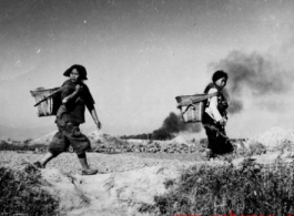 Chinese women flee Japanese air raid on Kunming during WWII.