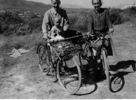 A western couple, "Mr. & Mrs. Muir" with child on bicycles in the Xiaguan/Dali area, near the outlet to Erhai Lake. During WWII.  This is the missionary couple Frank and Gladys Muir, and one of their two sons.