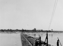 US vehicles cross a pontoon bridge somewhere in Burma.  10CU 5G7 9 BURMA ROAD (RES)
