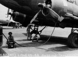 August 2, 1944: No "A" card needed, but the difficulties of filing the cavernous gas tanks of a C-47 cargo plane make "stateside" rationing problems child's play.
