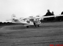 A PBY named 'Web Foot Maggie' in the CBI, tail number #433977.