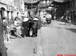 The Golden Horse 金马 archway in Kunming, and the other of the pair, the Emerald Rooster Archway (金马碧鸡坊), in the distance.  In the CBI during WWII.