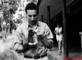 A young GI and his pet at Yangkai base, Yunnan, during WWII.