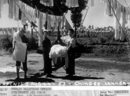 Chinese workers at an American base hang out the base laundry to dry in the sun, during WWII.  August 3, 1944