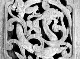 Traditional engraved woodwork on door panels in China.  From the collection of Eugene T. Wozniak.