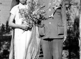 A wartime wedding in Yunnan province, China, with a very young and unenthusiastic bride. 