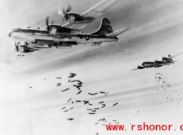 B-29 bombers in flight, dropping bombs. In the CBI during WWII.