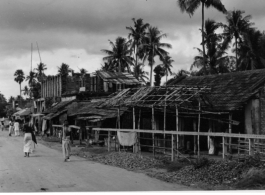 A roadside village in Burma or India during WWII.