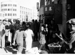 Street in Chinese city during WWII, possibly Kunming.  Photo from John Bondurant.