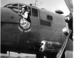 First Lt. Richard P. Kendall, pilot, leans out window of a 491st Bomb Squadron's B-25D aircraft in a revetment at Yang Chiseh Airfield, Yangkai, Yunnan Province, China. This plane has been modified with the twin .50 caliber machine gun side packs on lower fuselage side. Another would be on the opposite, starboard, side of the plane.