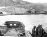 12th Air Service Group convoy crossing river by barge in China during WWII.