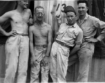 Men of the 12th Air Service Group in China goof for the camera: Left to right, Brantl, Wolfe, ? , ?