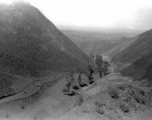 Mountains in northern China, with road, during WWII.