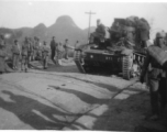 Marching Nationalist troops and an Nationalist tank Chinese armored tank (possibly a soviet T-26b) on the road in southern China. During WWII.