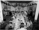 A banquet at the rally. At the end is a row of privileged foreign (American) military officers seated to the right and left, hosted by Zheng Tingji (郑庭笈), commander of the 48th Army Division (陆军第四十八师 ), at the center--showing that this rally is focused on the 48th Army Division.