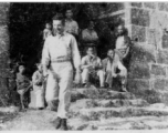 GI walking from gate in city wall in SW China, during WWII.