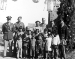 GIs and children at the decorated gate of the No. 21 Guest House (二十一招待所) in SW China (likely Yunnan) during WWII.