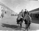 SACO men on mules on the street in Shaanba (陕坝镇), Inner Mongolia, China, during WWII.