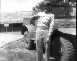 Captain Wilson Porch & monkey outside of the Officers Club Mess hall.  Shamshernagar Air Base India, June 1945.