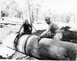 797th Engineer Forestry Company mill in Burma, loading logs for milling for bridge building along the Burma Road.  During WWII.