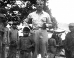 Douglas J. Runk poses with local kids and soldiers in SW China during WWII.